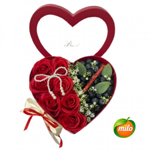 A basket of blueberry and floral gift box