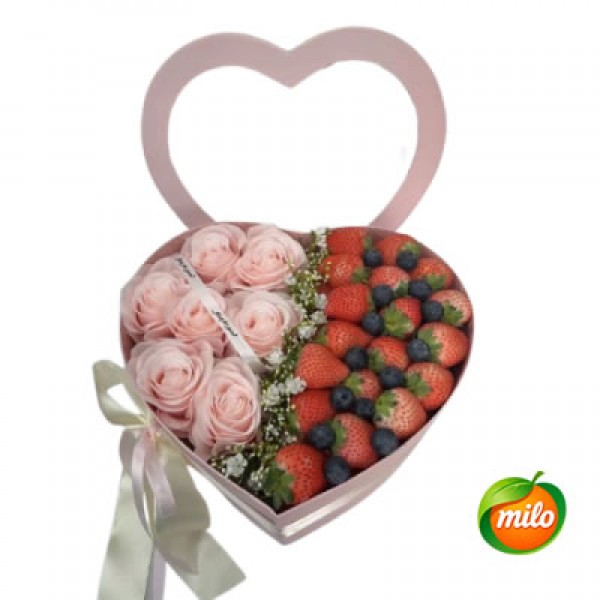 A basket of strawberry, blueberry and flower gift box