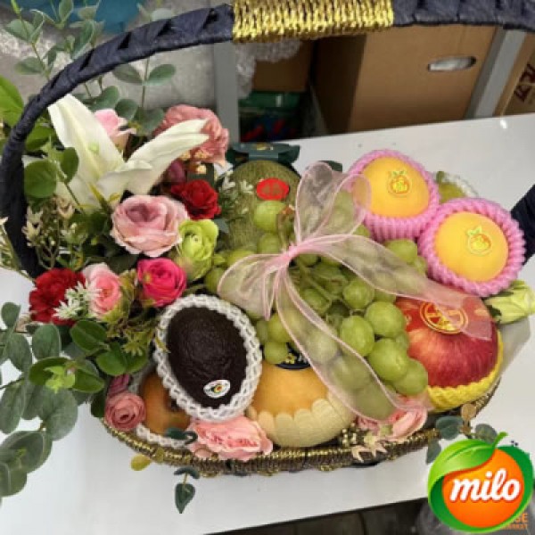 A basket of mixed fruit gift boxes